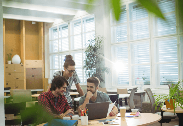 group-business-executives-discussing-laptop-their-des